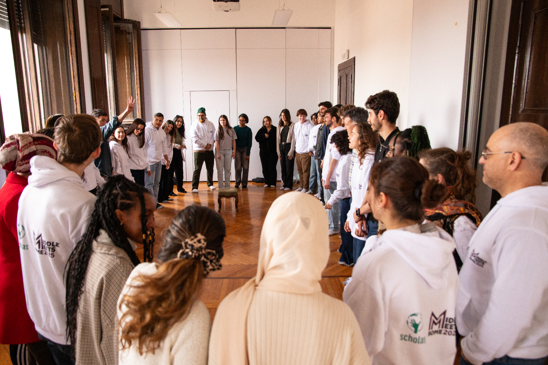 Middle Meets participants gathered in a circle during a facilitated dialogue